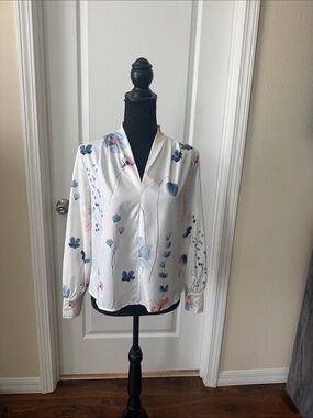 White blouse with dusty blue and pink flowers